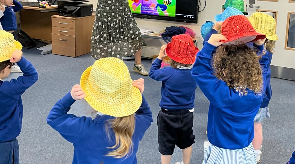 Hats, Scarves and Sunshine: Nursery Enjoy a Joyful Music Lesson with Mrs Swan